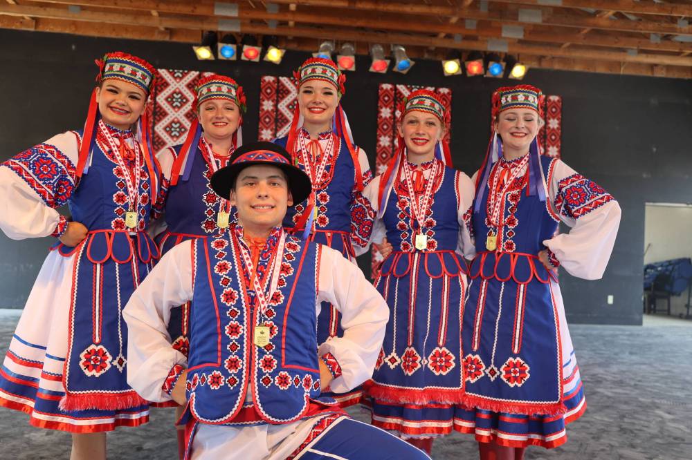 Benito Vesselli Dance Club members pose for a picture with their gold medals on Saturday. The group earned first place in the Canada's National Ukrainian Festival alent competition, receiving a score of 92 — a gold — and a $750 prize. (Abiola Odutola/The Brandon Sun)