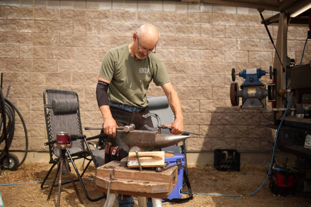 Todd Bailey, a farrier from Saskatoon, works on horseshoes for half-Arabian horse Remy with Milligan Training of Foam Lake, Sask., during the first day of Canada’s National Arabian Championship on Thursday.
