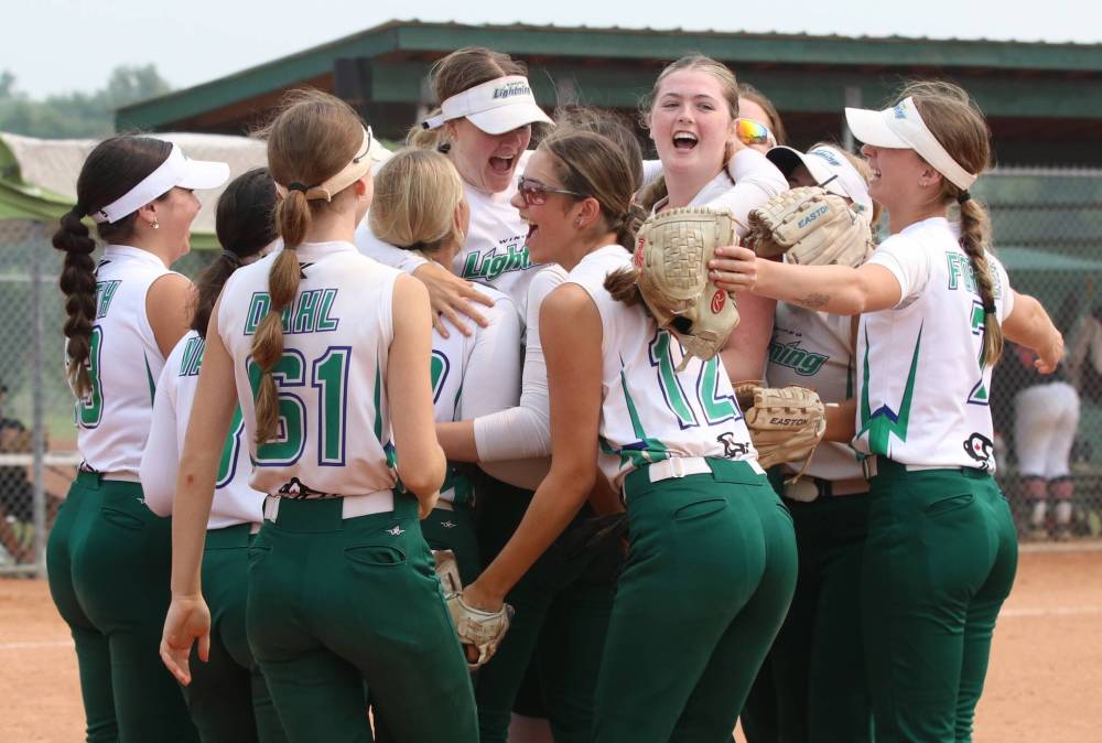The Winnipeg Lightning celebrate after beating the Smitty's Terminators 3-2 in the final at the under-19 western Canadian softball championship at Ashley Neufeld Softball Complex on Sunday. (Perry Bergson/The Brandon Sun)