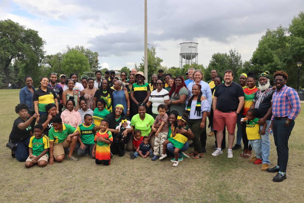 Brandon East MLA Glen Simard, Mayor Jeff Fawcett, wife, Jodi, and Brandon West MLA Wayne Balcaen celebrate with the Westman Jamaican Community during their annual Belly Business gathering at Rideau Park on Saturday afternoon. (Photos by Abiola Odutola/The Brandon Sun)