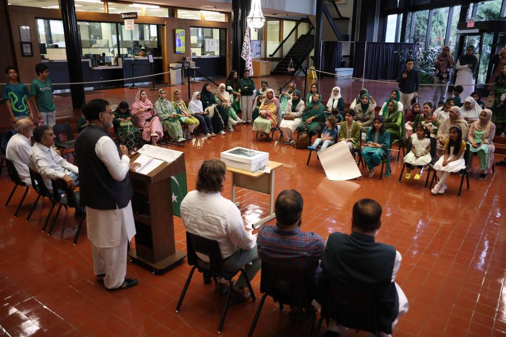 Amjad Malik, a professor at the University College of the North in Thompson, speaks at city hall during Thursday’s celebrations.