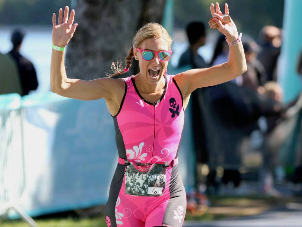 Shauna Krawchuk (6) celebrates the end of her Sprint race at the Riding Mountain Triathlon in Wasagaming on Saturday. (Perry Bergson/The Brandon Sun)