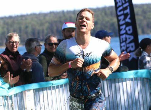 An exhausted Olympic men's race winner Patrick Labossiere (1151) approaches the finish line at the Riding Mountain Triathlon in Wasagaming on Saturday. (Perry Bergson/The Brandon Sun)