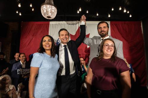 Anaida Poilievre (from left), Conservative Party Leader Pierre Poilievre, Damien Kurek and Danielle Kurek celebrate Pierre Poilievre&rsquo;s win during the Battle River-Crowfoot byelection in Camrose, Alta., on Monday. Poilievre passed the first challenge to his leadership following his election loss; the next will be his party leadership review in January. (The Canadian Press)