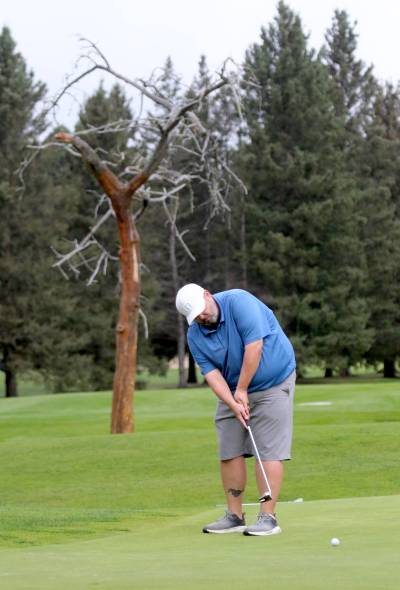 Greg Misener putts on the fifth hole during Tamarack golf tournament men’s championship flight action on Tuesday. (Photos by Thomas Friesen/The Brandon Sun)