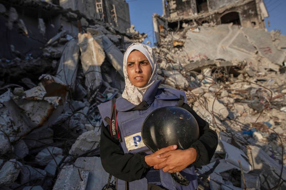 Freelance journalist Mariam Dagga, 33, who had been working with The Associated Press and other outlets during the Gaza war, poses for a portrait in Khan Younis, southern Gaza Strip, on June 14, 2024. She was among at least 19 people, including five journalists, killed Monday in Israeli strikes on Nasser Hospital in Khan Younis. (The Associated Press files)