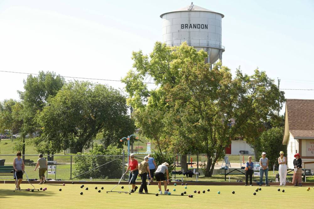 Lawnbowling enthusiasts concentrate on their play in Rideau Park. (Tim Smith/The Brandon Sun)