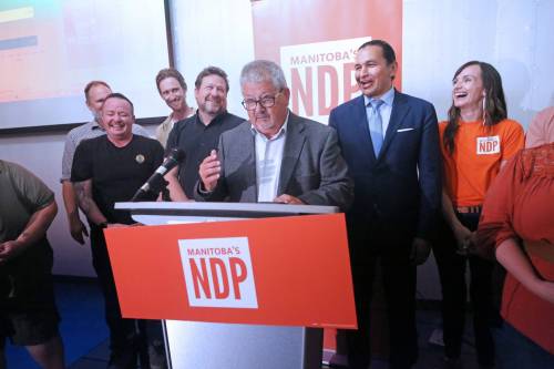 Flanked by Brandon East MLA Glen Simard and Manitoba Premier Wab Kinew, Spruce Woods NDP candidate Ray Berthelette addresses his supporters following his narrow second-place byelection finish to PC candidate Colleen Robbins on Tuesday night at The Backyard on Aberdeen in Brandon. (Matt Goerzen/The Brandon Sun)