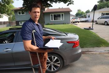 Chris Bird stands on Christie Bay, where he was door knocking at homes in July to collect signatures on a petition opposing a proposed cell tower in the area. (Connor McDowell/The Brandon Sun files)