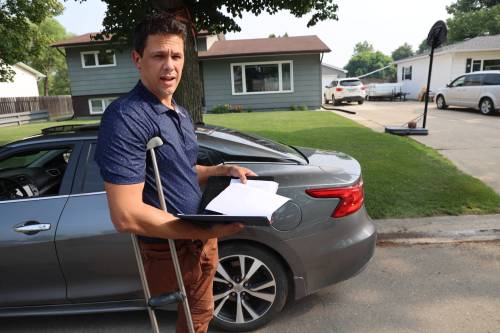 Chris Bird stands on Christie Bay, where he was door knocking at homes in July to collect signatures on a petition opposing a proposed cell tower in the area. (Connor McDowell/The Brandon Sun files)