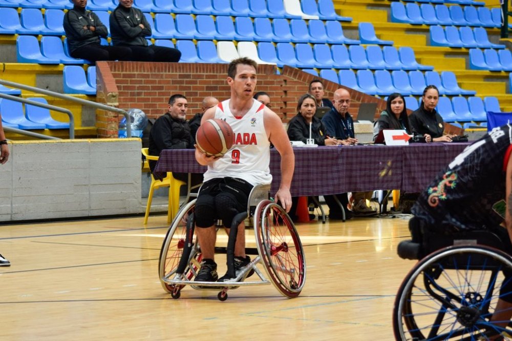 Canada's Colin Higgins (9) looks for an opening during the team's game against Mexico at the 2025 IWBF Americas Cup wheelchair basketball tournament, in Bogota, Colombia, in a Monday, Aug. 18, 2025, handout photo. THE CANADIAN PRESS/Handout - IWBF (Mandatory Credit)