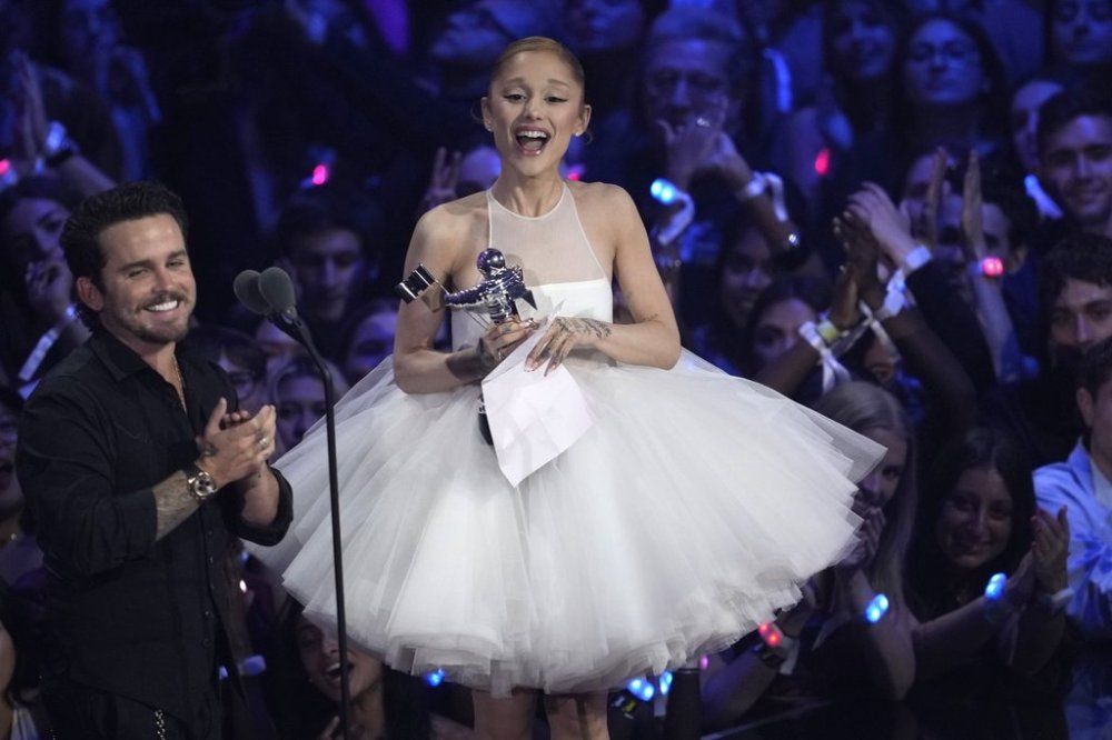 Christian Breslauer, left, and Ariana Grande accept the award for video of the year for