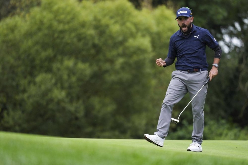 Angel Hidalgo reacts after making par on the 17th hole during the third round of the Irish Open golf tournament, Saturday, Sept. 6, 2025, at The K Club in Straffan, Ireland. (Brian Lawless/PA via AP)