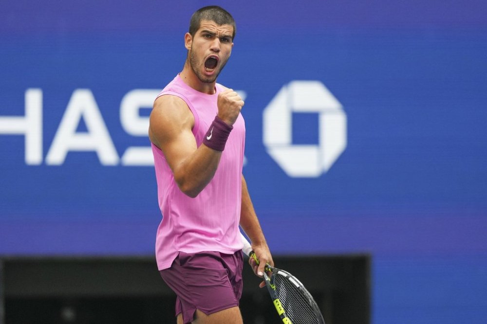 Carlos Alcaraz, of Spain, reacts after winning the second set against Novak Djokovic, of Serbia, during the men's singles semifinals of the U.S. Open tennis championships, Friday, Sept. 5, 2025, in New York. (AP Photo/Kirsty Wigglesworth)