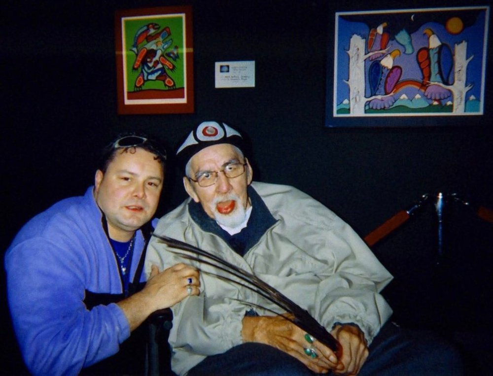 A handout photo provided by Mark Jacobson shows him on the left with fellow Indigenous artist Norval Morrisseau at an exhibition in 2005. Jacobson is suing Morrisseau's estate over an allegation that he was sexually assaulted by Morrisseau. THE CANADIAN PRESS/Handout — Mark Jacobson (Mandatory Credit)