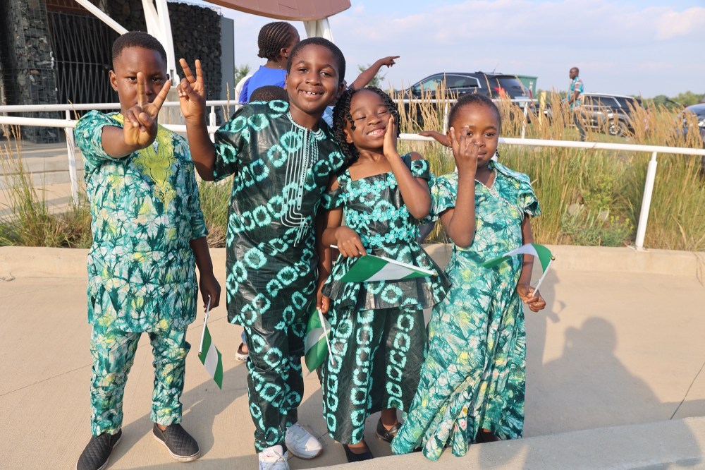 Isaac Osho (from left), Oreoluwa Agbolade, Nifesimi Agbolade and Esther Osho show excitement in their traditional clothes during the Naija Summer Fair. Organized by members of the United Nigerians in Brandon Association on Saturday evening at Riverbank Discovery Centre. (Abiola Odutola/The Brandon Sun)