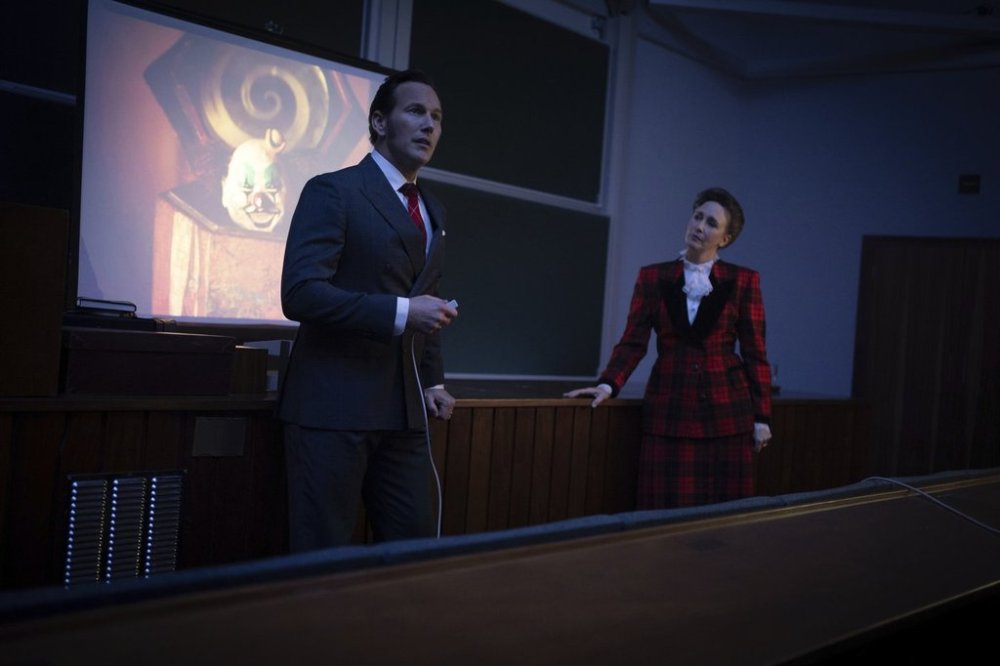 This image released by Warner Bros. Pictures shows Patrick Wilson, left, and Vera Farmiga in a scene from