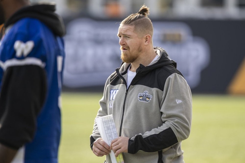Injured Winnipeg Blue Bombers linebacker Adam Bighill watches on the sidelines during practice in Hamilton, Ont., Thursday, Nov. 16, 2023. Winnipeg Blue Bombers will play the Montreal Alouettes in the 110th Grey Cup on Sunday. THE CANADIAN PRESS/Nick Iwanyshyn