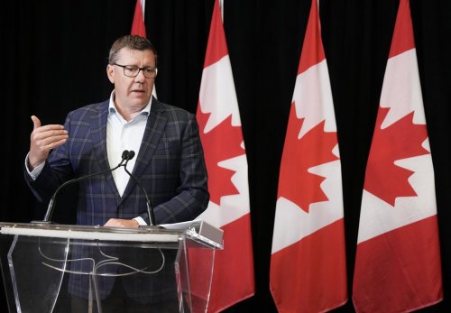 Saskatchewan Premier Scott Moe speaks to the media after signing a memorandum of understanding with Alberta and Ontario during the 2025 summer meetings of Canada's Premiers at Deerhurst Resort in Huntsville, Ont., on Tuesday, July 22, 2025. THE CANADIAN PRESS/Nathan Denette