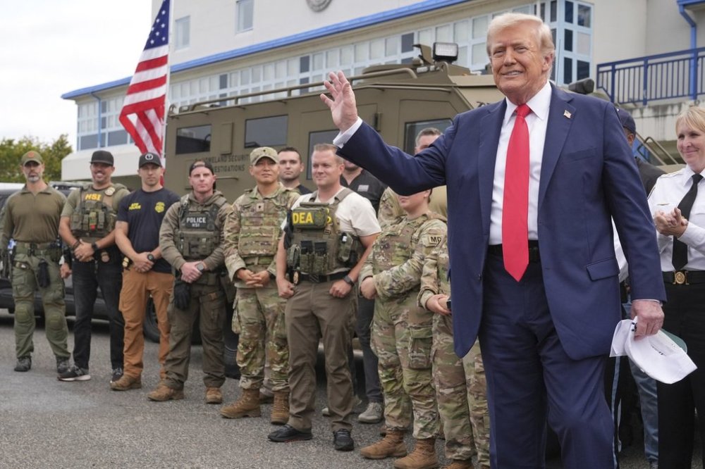 President Donald Trump speaks with members of law enforcement and National Guard soldiers on Aug. 21 in Washington. (The Associated Press files)
