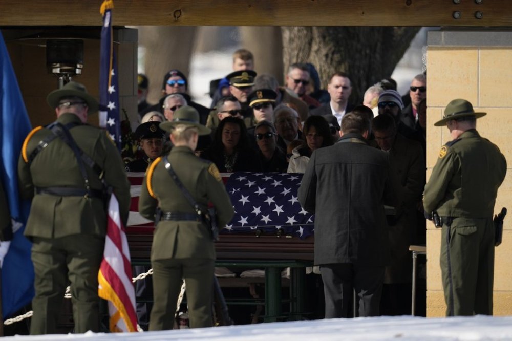 FILE - U.S. Border Patrol agent David Maland is recognized with military honors before his burial at Fort Snelling National Cemetery in Minneapolis, on Feb. 22, 2025. (AP Photo/Abbie Parr, file)