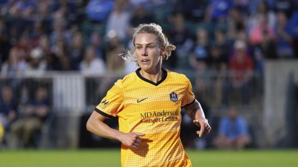 Houston Dash's Sophie Schmidt (13) defends during an NWSL soccer match, Saturday, March 16, 2024, in Cary, N.C. (AP Photo/Ben McKeown)