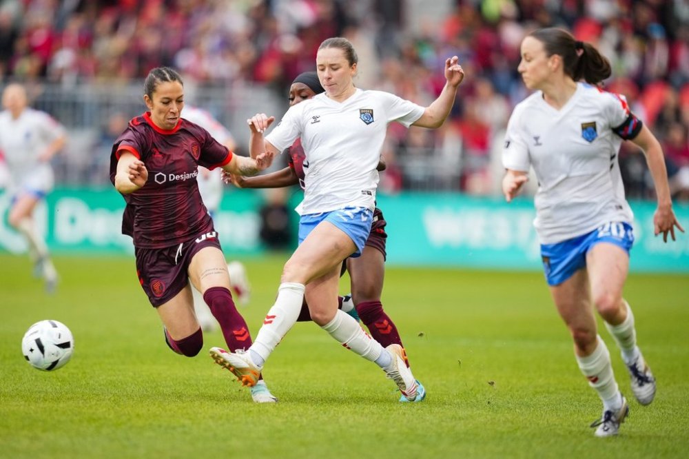 AFC Toronto midfielder Victoria Pickett (94) and Montreal Roses FC forward Tanya Boychuk (12) battle for control of the ball during first half Northern Super League soccer action in Toronto on Saturday, April 19, 2025. THE CANADIAN PRESS/Arlyn McAdorey