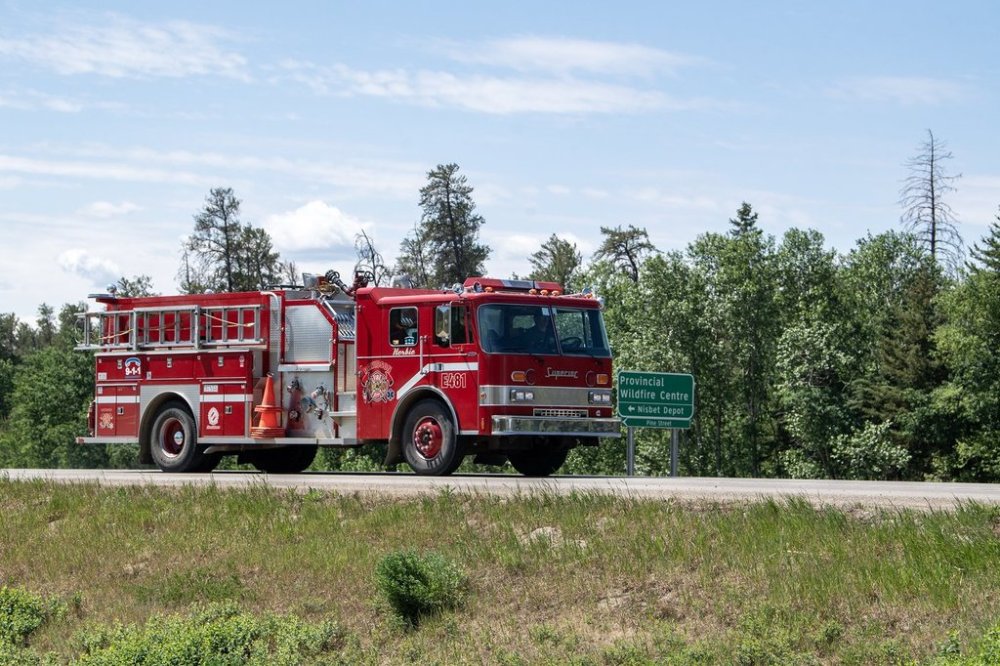 Volunteer firefighters from Davidson, Sask., load up their truck at the Provincial Wildfire Center in Prince Albert, Sask., Wednesday, June 4, 2025. THE CANADIAN PRESS/Liam Richards