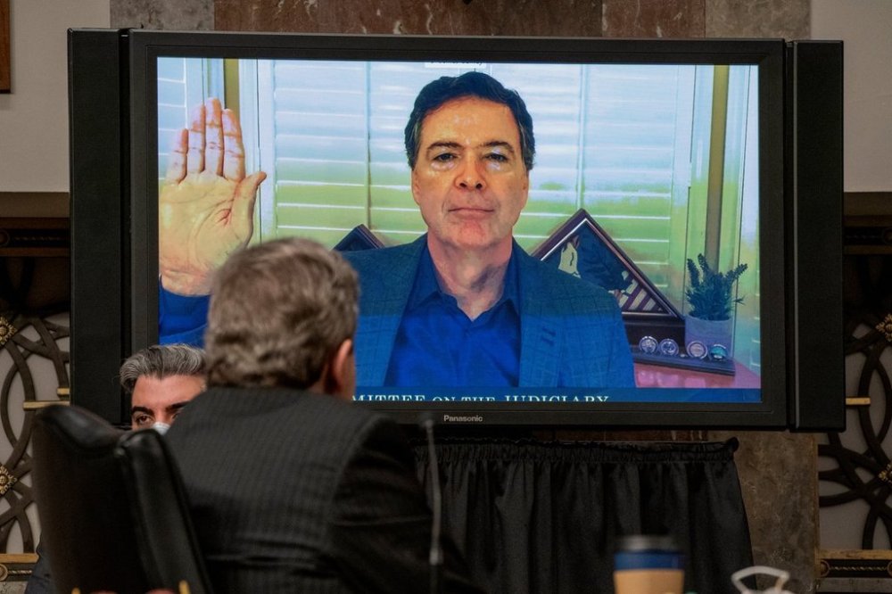 FILE - Former FBI director James Comey is sworn via videoconference before testifying during a Senate Judiciary Committee hearing on Capitol Hill in Washington, Wednesday, Sept. 30, 2020, to examine the FBI