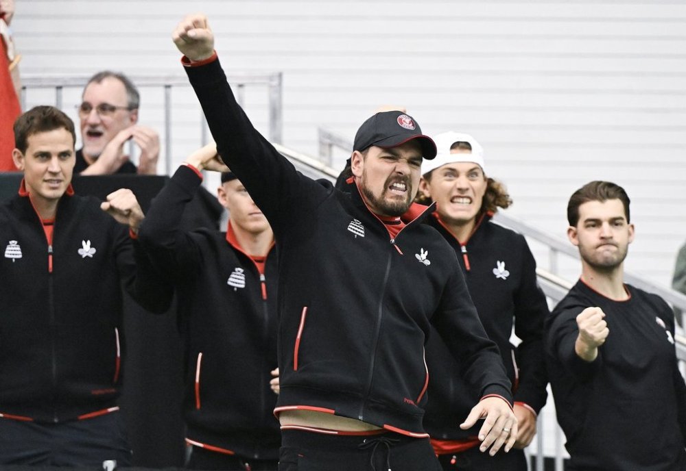 Team Canada captain Frank Dancevic and players react during a Davis Cup qualifying tennis match between Alexis Galarneau, of Canada, and Marton Fucsovics, of Hungary, in Montreal on Sunday, February 2, 2025. THE CANADIAN PRESS/Graham Hughes