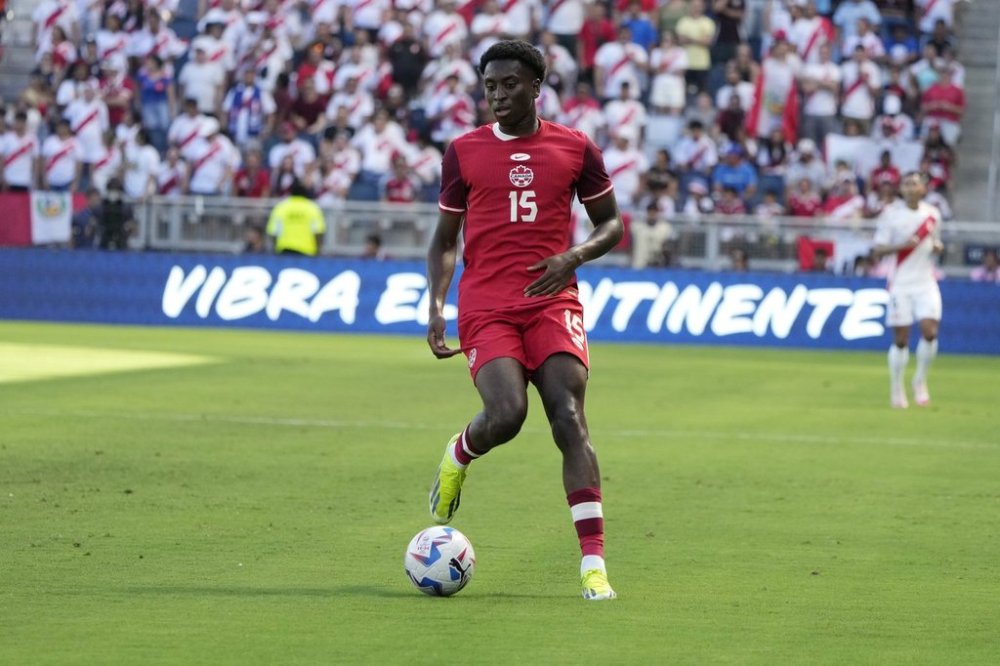 Canada's Moïse Bombito controls the ball during the first half of a Copa America Group A soccer match in Kansas City, Kan., Tuesday, June 25, 2024. (AP Photo/Ed Zurga)