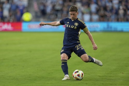 Vancouver Whitecaps attacker Ryan Gauld kicks the ball during the first half of an MLS soccer match Wednesday, May 29, 2024, in Kansas City, Kan. (AP Photo/Charlie Riedel)