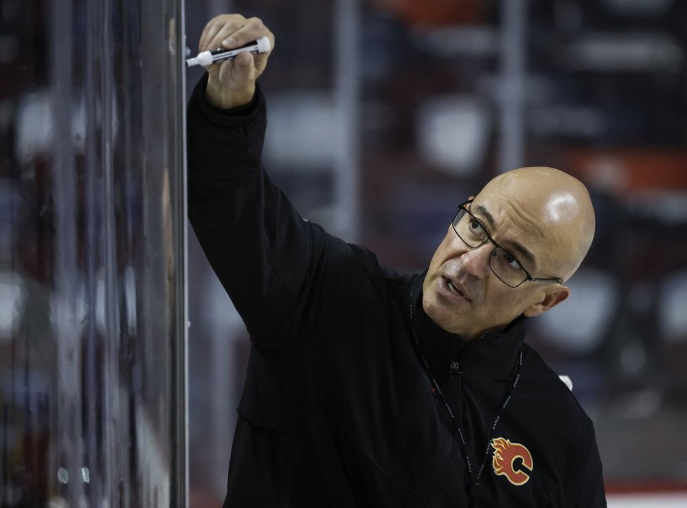 Calgary Flames' head coach Ryan Huska describes a training drill during a training camp practice in Calgary, Alta., Thursday, Sept. 18, 2025. THE CANADIAN PRESS/Jeff McIntosh