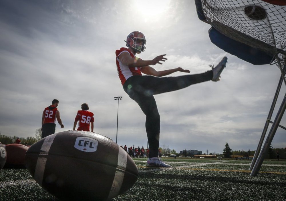 Calgary Stampeders punter Mark Vassett kicks the ball during the first of training camp in Calgary, Sunday, May 11, 2025. THE CANADIAN PRESS/Jeff McIntosh