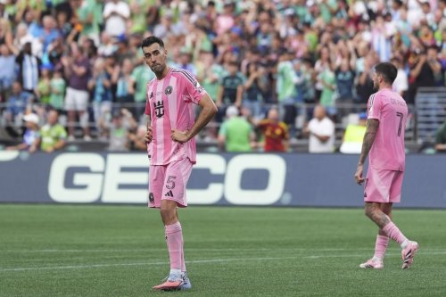 Inter Miami midfielder Sergio Busquets (5) and midfielder Rodrigo De Paul (7) react after a goal by Seattle Sounders midfielder Paul Rothrock during the Leagues Cup final soccer match Sunday, Aug. 31, 2025, in Seattle. (AP Photo/Lindsey Wasson)