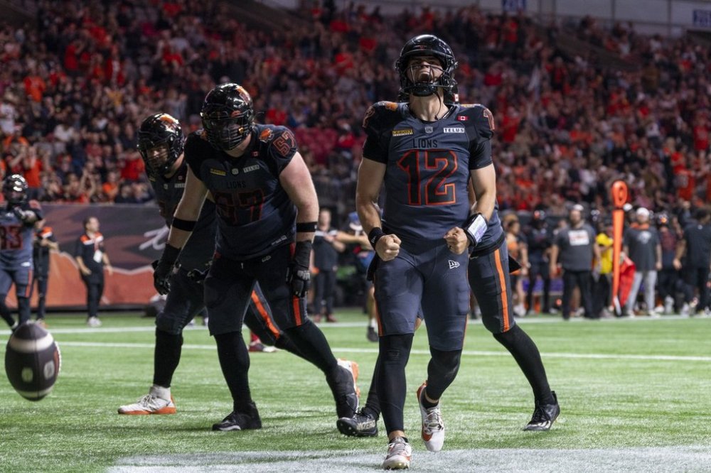 B.C. Lions quarterback Nathan Rourke (12) celebrates his touchdown run against the Ottawa Redblacks during the first half of a CFL football game in Vancouver, on Friday, Sept. 12, 2025. THE CANADIAN PRESS/Jimmy Jeong