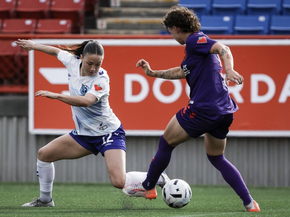 Ottawa Rapid's Delaney Baie Pridham, left, tries to get the ball past Calgary Wild's Meikayla Moore during second half Northern Super League soccer action in the in Calgary, on Sunday, May 11, 2025.THE CANADIAN PRESS/Jeff McIntosh