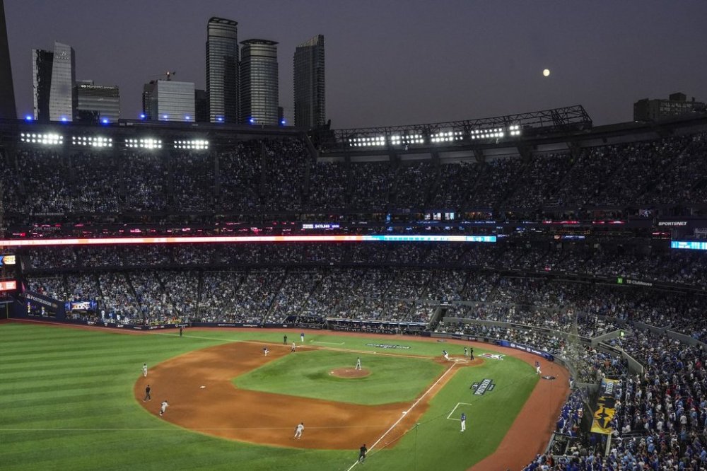 Toronto Blue Jays first baseman Vladimir Guerrero Jr. (27) hits a single against the New York Yankees during the eighth inning of game 1 in MLB American League Division Series baseball action in Toronto on Saturday, Oct. 4, 2025. THE CANADIAN PRESS/Chris Young