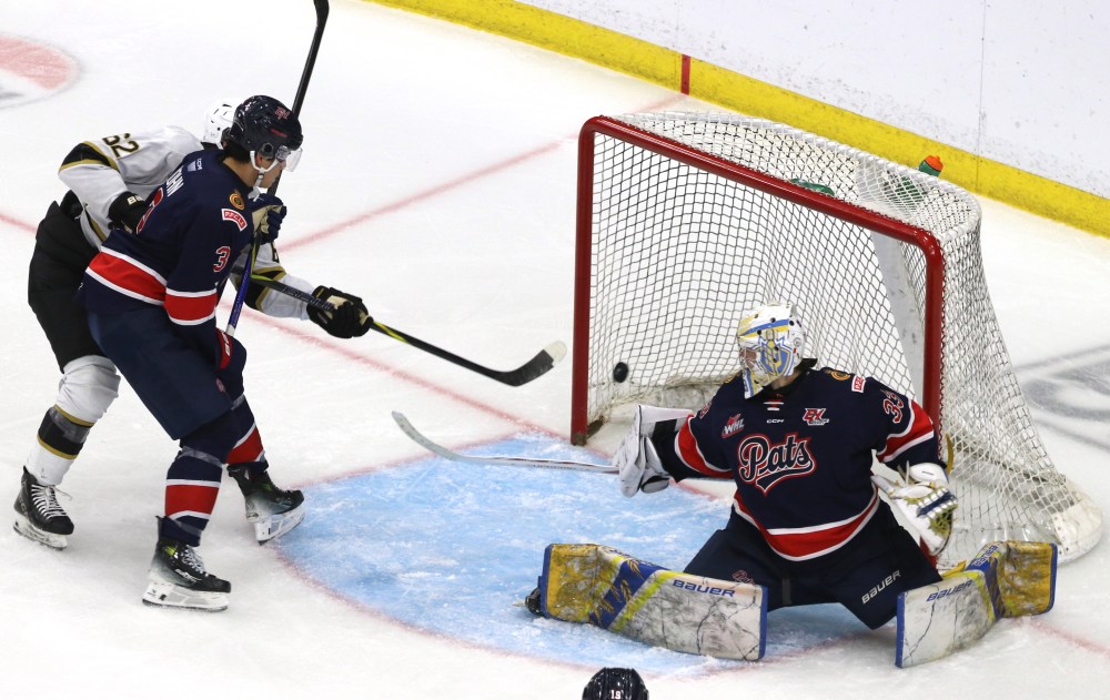 Brandon Wheat Kings forward Nick Johnson (62) tips a shot behind Regina Pats goalie Drake Mooney (33) as defenceman Jonas Kohn (3) tries to tie him up during Western Hockey League pre-season action at Assiniboine Credit Union Centre on Saturday. (Perry Bergson/The Brandon Sun)
Sept. 6, 2025