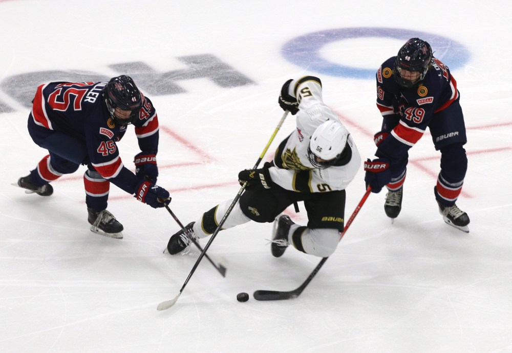 Brandon Wheat Kings forward Prabh Bhathal (56) is hauled down by Regina Pats Sam Failer (45) and Jett Deschamps (49) during Western Hockey League pre-season action at Assiniboine Credit Union Centre on Saturday. (Perry Bergson/The Brandon Sun)
Sept. 6, 2025