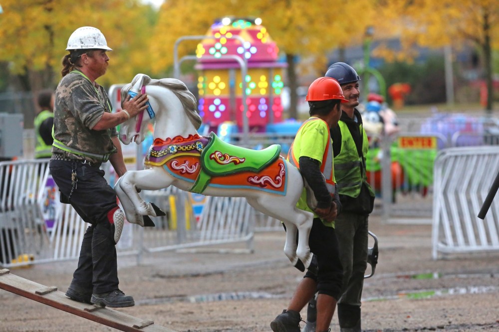 A work crew with Select Shows unloads one of 30 carousel horses during a Thursday afternoon midway set up. Select Shows will hold its final show in Brandon this season, starting today for the Fall Fair at the Keystone Centre grounds. Gates open at 5 p.m. (Matt Goerzen/The Brandon Sun)