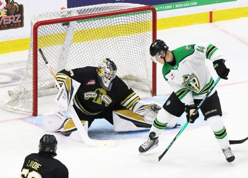 Brandon Wheat Kings goalie Jayden Kraus (33) watches the puck hit the ankle of Prince Albert Raiders forward Max Heise (14) during Western Hockey League action at Assiniboine Credit Union Place on Saturday. (Perry Bergson/The Brandon Sun)
Sept. 27, 2025