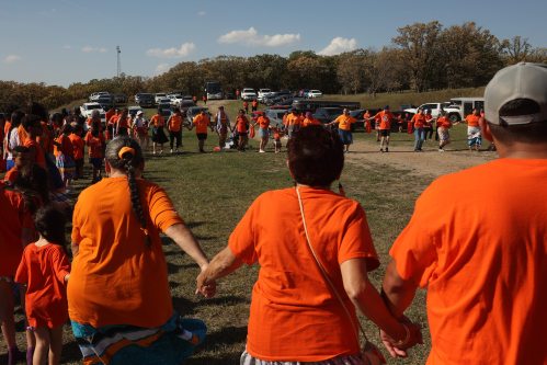 Participants take part in a round dance following the 2025 Truth and Reconciliation Week Orange Shirt Day Walk to the former Brandon Indian Residential School site. (Tim Smith/The Brandon Sun files)