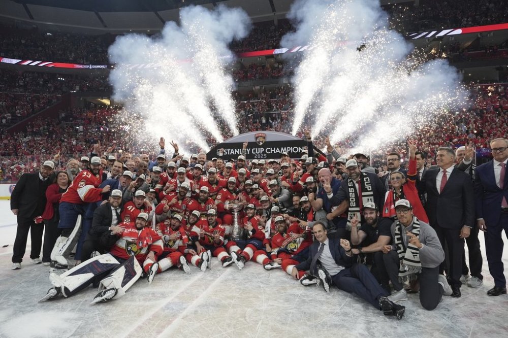The Florida Panthers pose with the Stanley Cup after defeating the Edmonton Oilers in Game 6 of the Stanley Cup final in Sunrise, Fla., on Tuesday, June 17, 2025. (AP Photo/Lynne Sladky)