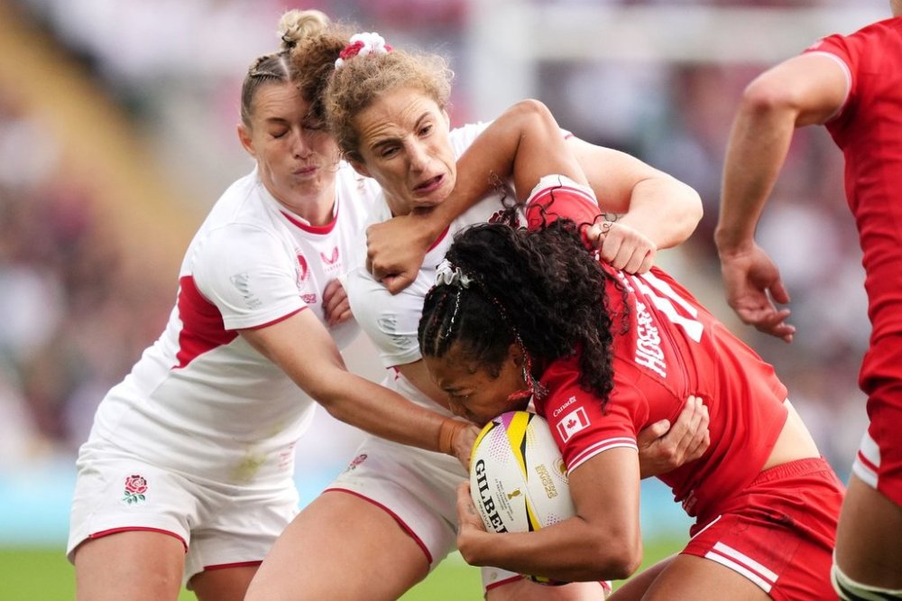 England's Abby Dow tackles Canada's Asia Hogan-Rochester during the Women's Rugby World Cup final match between England and Canada at the Allianz Stadium, Twickenham, London, Saturday, Sept. 27, 2025. (Ben Whitley/PA via AP)