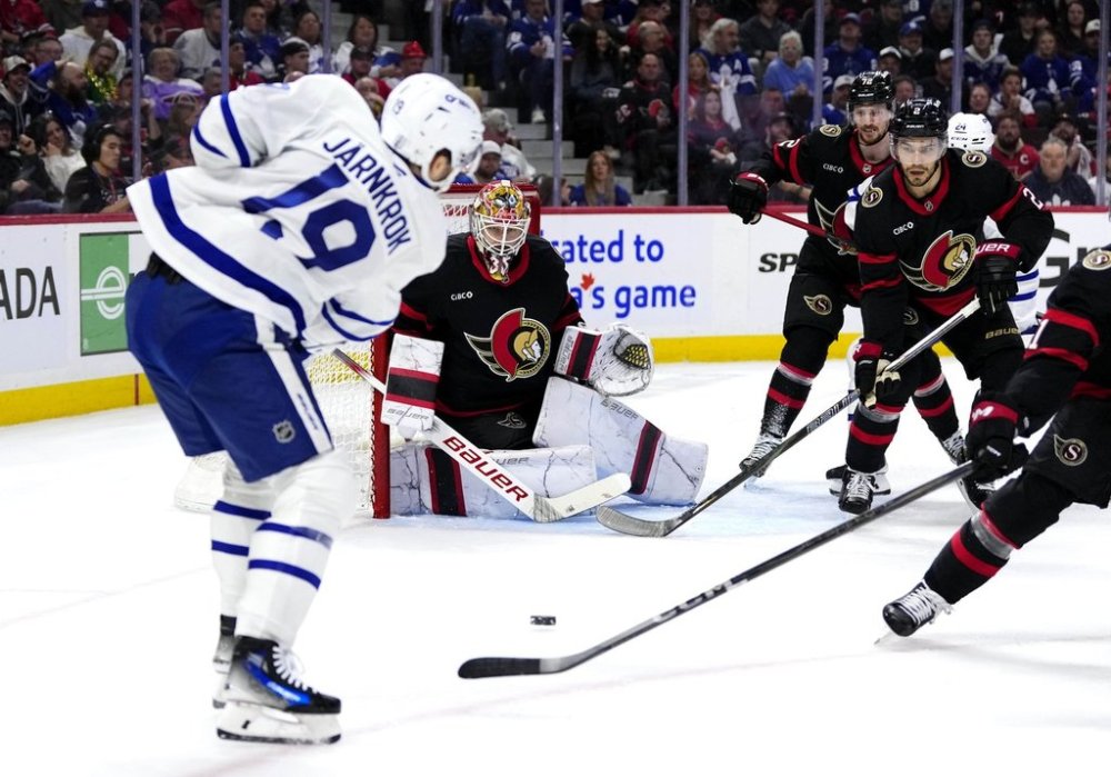 Ottawa Senators goaltender Linus Ullmark (35) looks to make the save on a shot by Toronto Maple Leafs' Calle Jarnkrok (19) as Senators's Artem Zub (2) and Thomas Chabot (72) defend, during first period NHL playoff action in Ottawa, on Saturday, April 26, 2025. THE CANADIAN PRESS/Justin Tang
