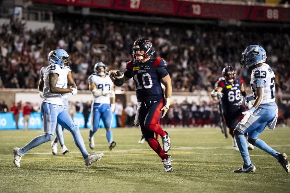 Montreal Alouettes quarterback Davis Alexander (10) scores during second half CFL action against the Toronto Argonauts in Montreal on Thursday, July 17, 2025. THE CANADIAN PRESS/Christopher Katsarov