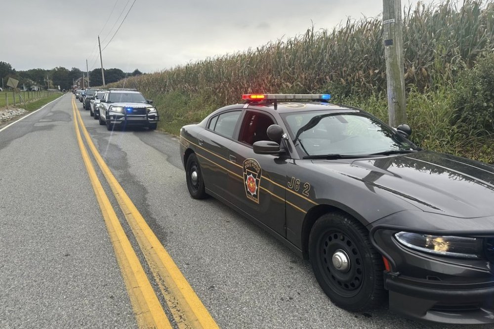 Police cordon off the area around a shooting involving police officers in North Codorus, Pa., on Wednesday, Sept. 17, 2025. (AP Photo/Mark Scolforo)