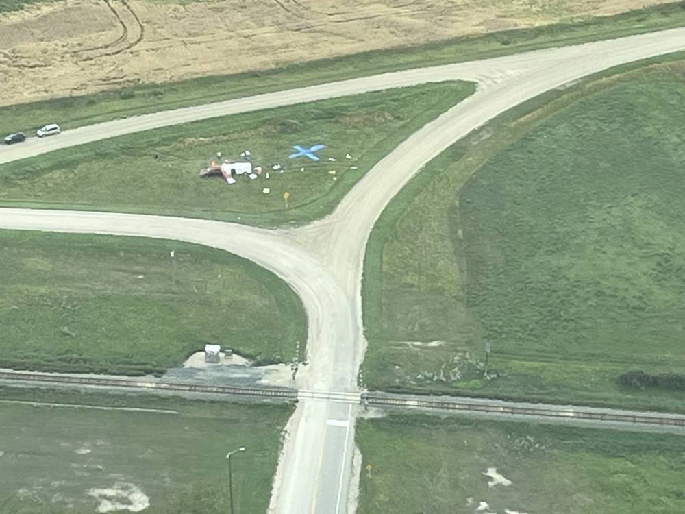 LEFT: A simulated crash scene outside Brandon is marked by a blue “X,” and strewn tarps and cardboard. The scene helped civilian search and rescue volunteers practise during a weekend conference for Western Canada. (Supplied)
ABOVE: An aircraft sees the light of the morning as it is rolled out onto the tarmac ahead of CASARA exercises in Brandon. (Connor McDowell/The Brandon Sun)