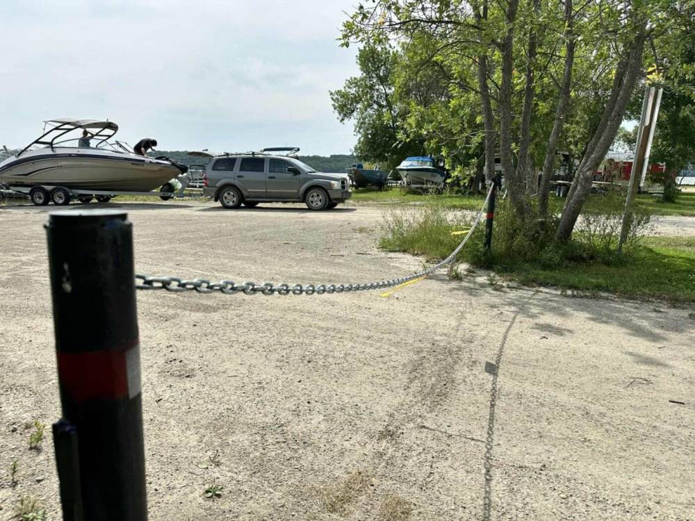 The Rural Municipality of Prairie Lakes’ new boating regulations are helping keep Pelican Lake free of invasive zebra mussels, but the rules and fees have sparked concerns among Ninette residents and businesses are already struggling with tourism declines and the temporary closure of the local Tempo gas station. (Photo by Steven Sukkau, LJI Reporter)